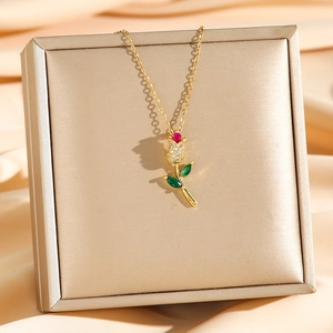 Elegant tulip necklace in gold finish with red gemstone and sparkling zircon accents