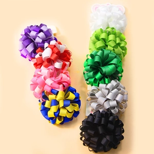 Handmade grosgrain ribbon flower hair ties for kids in various vibrant colors