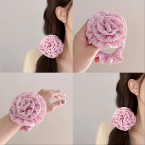 Pink lace rose hair scrunchie shown in multi-angle views and as a ponytail holder