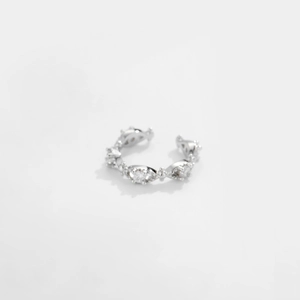 Detailed view of silver open cuff ring with sparkling diamond-shaped zircon settings
