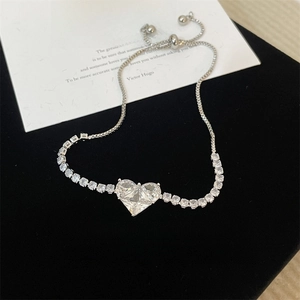 Elegant heart-shaped crystal bracelet in silver finish with adjustable star link chain