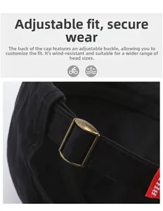 Detail of adjustable metal buckle and red BH brand tag on a black cotton baseball cap