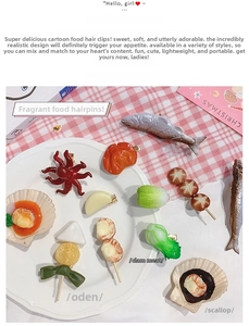 Detail view of realistic resin food hair clips featuring fish and vegetable designs