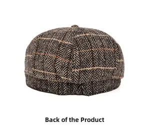 Rear view of herringbone newsboy hat featuring orange windowpane pattern and textured fabric
