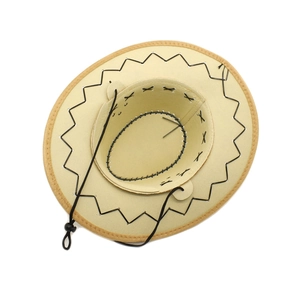 Detail of western cowboy hat stitching and adjustable chin strap on khaki faux suede