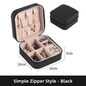 Detail view of the black PU jewelry box interior with pink velvet lining and 10x10x5cm size