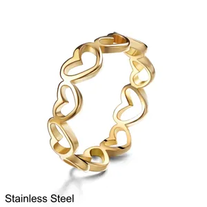 Polished golden stainless steel ring featuring a minimalist hollow heart-shaped design