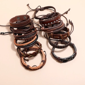 Set of vintage braided leather bracelets with various metal charms and wooden beads