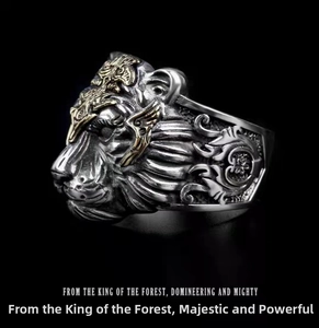 Detailed close-up of a vintage tiger head ring with intricate silver and gold textures