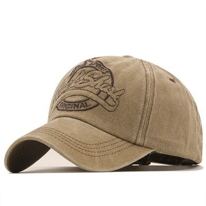 Detail view of 3D outdoor sports embroidery on vintage washed canvas baseball cap