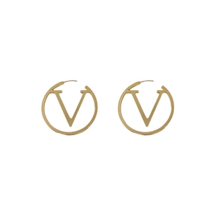 Chic gold circle earrings with V-shaped metal cutout in a minimalist fashion style