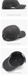 Detailed view of washed dark grey cotton baseball cap with vintage distressed edges and buckle