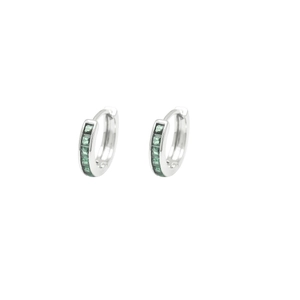 Detailed close-up of silver huggie earrings with five square green zircon stones
