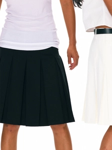 Academy style low waist pleated skirt in black and white minimalist design