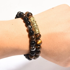 Tiger eye and black agate beaded bracelet set with engraved gold-tone curved tube charm