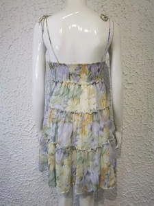 Back view of floral backless dress showing layered skirt and elastic waist detail