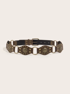 Detailed view of vintage PU leather belt with bohemian metal discs and bronze buckles