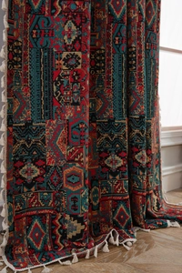 Detailed jacquard weave pattern on bohemian curtain with elegant white decorative tassels