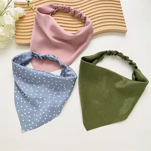 Three-piece satin headband set in pink, blue polka dot, and green with elastic bands