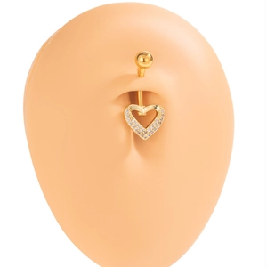Golden heart navel ring with crystals worn on a model belly with white background