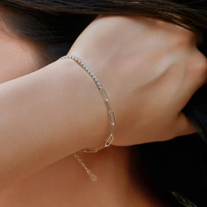 Detail of S925 silver tennis chain and paperclip link bracelet with cubic zirconia