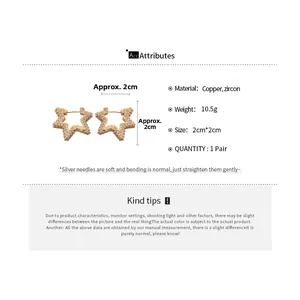 Detailed view of gold star hoop earrings with zircon stones and dimensions