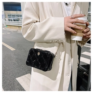 Fashionable black quilted PVC crossbody bag for girls with gold chain strap in street style