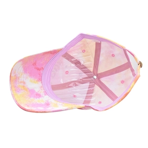 Detailed interior of tie-dye baseball cap featuring pink lining and six-panel structure