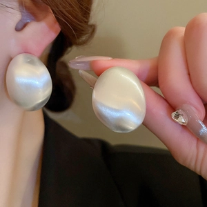 French vintage oval geometric earrings with high-gloss metallic finish and baroque texture