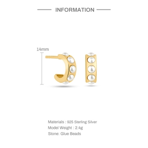 Detail of 14mm C-shape 925 sterling silver earrings with white beads and gold plating