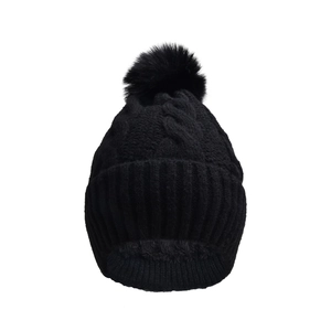 Detailed knit texture of a black winter hat featuring a faux fur pompom and fleece lining