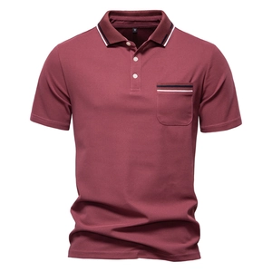 Close-up of wine red men's polo shirt featuring striped collar and chest pocket detail