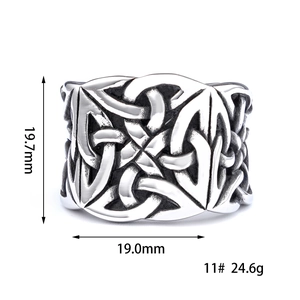 Detailed view of Celtic knot pattern on wide vintage steel ring with size measurements