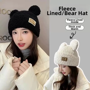 Detail of bear ear knit hat showing thick plush fleece lining for winter warmth