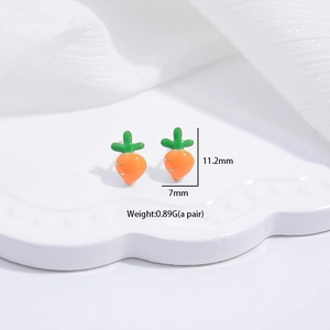 Detailed view of carrot stud earrings with dimensions 11.2mm by 7mm and weight specs