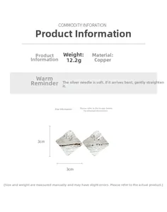 Detailed specs of rhombus textured earrings featuring 18k gold plating and silver needles