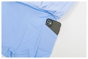 Detail of light blue tennis skirt with built-in pocket holding a smartphone