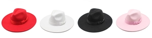 Row of wide brim wool fedora hats in red, white, black and pink with ribbon bands