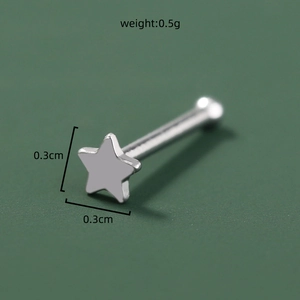 Close-up of star-shaped stainless steel nose stud with size 0.3cm and weight 0.5g