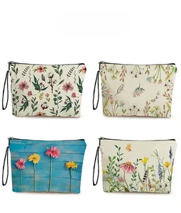 Detailed pattern overview of four floral print cosmetic bags with zippers and handles