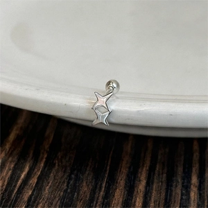 Minimalist S925 sterling silver double star stud earrings with screw back on a white ceramic dish