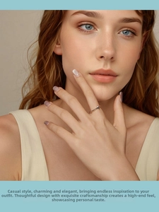 Close-up of minimalist S925 sterling silver cross ring worn on finger for elegant styling