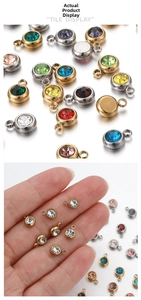 Macro shot of colorful round birthstone pendants with gold and silver bezel settings