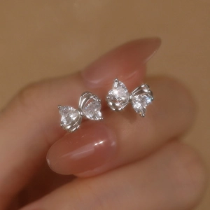 Elegant S925 sterling silver bow knot stud earrings with sparkling cubic zirconia stones