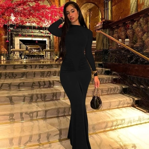 Detail of ruched waist design on a slim fit black long sleeve maxi dress for women