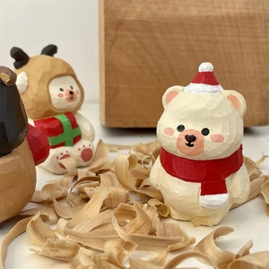 Handcrafted wooden Christmas bear figurines with hand-carved textures and festive hats