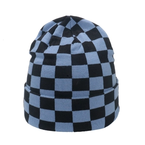 Detailed knit texture and blue checkerboard pattern on a soft winter beanie hat