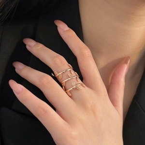 Close-up of 925 silver leaf wrap ring in rose gold finish on woman's finger