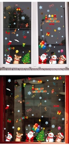 Detailed Christmas window decals featuring Santa, snowman, and reindeer on glass frames