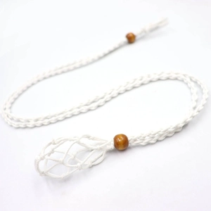 Close-up of white handmade woven net necklace cord with brown adjustable wooden beads